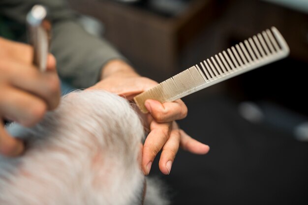 barber-hand-with-comb_23-2148181863